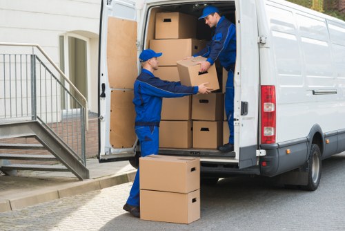 Low-carbon moving van loading recyclable items for local transfer station processing