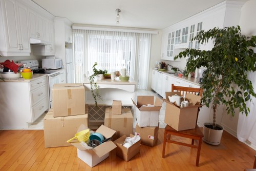 Commercial removals planning with labelled boxes and office furniture in Merton