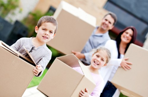 Furniture removals team planning a move in a Merton residential street