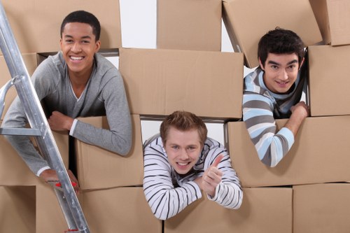 Furniture and boxes being moved with a truck for a Merton home relocation