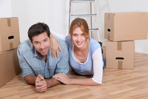 Professional movers handling household items in a flat move