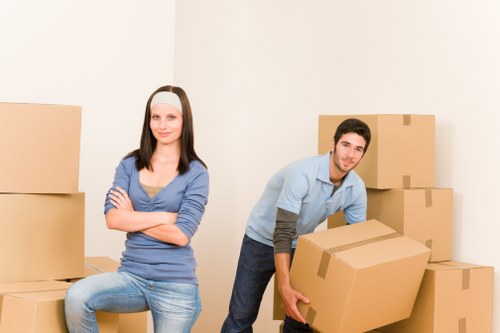 Packed moving boxes and furniture for a home removal service in Merton