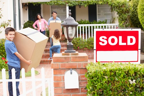 Local commercial movers loading office equipment carefully
