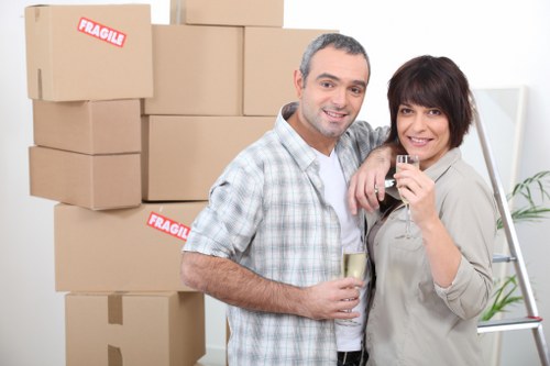 Trained movers handling furniture carefully during a relocation